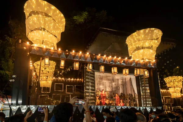 stock image Kolkata, West Bengal, India - 12th October 2021 : Durga Puja, UNESCO Intangible cultural heritage of humanity. Devotees visiting decorated Durga Puja pandal at night.