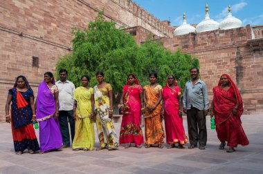 Jodhpur, Rajasthan, India - 19th October 2019 : Rajasthani women wearing colourful Indian sarees visting Mehrangarh fort. Unesco World heritage site, popular tourist spot for International tourists.