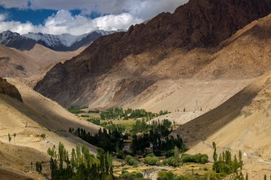 Beautiful play of light on the valley of Basgo, snow capped Himalayan mountains in the background. Leh, Union territory of Ladakh, India.