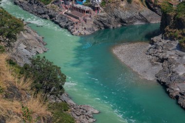 Bhagirathi river from left side and Alakananda river with turquoise blue colour from right side converge at Devprayag,Holy conflunece and form river Holy Ganges thereafter.Garhwal, Uttarakhand, India.