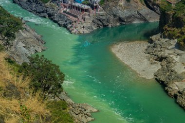 Bhagirathi river from left side and Alakananda river with turquoise blue colour from right side converge at Devprayag,Holy conflunece and form river Holy Ganges thereafter.Garhwal, Uttarakhand, India.