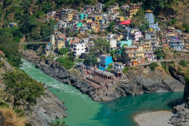 Hotels and resorts of Devprayag, Garhwal, Uttarakhand, India. Bhagirathi river from left side and Alakananda river with turquoise blue colour from right side converge at Devprayag, Holy conflunece.