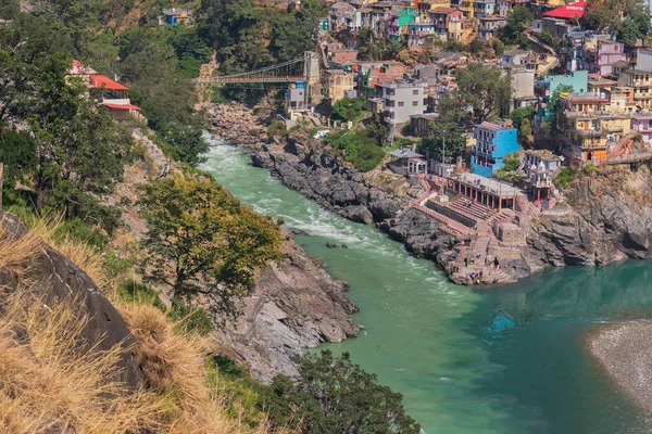 Bhagirathi river from left side and Alakananda river with turquoise blue colour from right side converge at Devprayag,Holy conflunece and form river Holy Ganges thereafter.Garhwal, Uttarakhand, India.