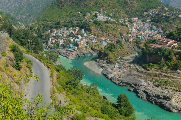 stock image Devprayag, Godly Confluence,Garhwal,Uttarakhand, India. Here Alaknanda meets the Bhagirathi river and both rivers thereafter flow on as the Holy Ganges river or Ganga. Sacred place for Hindu devotees.