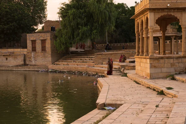 stock image Jaisalmer, Rajasthan, India - 13.10.2019 : Chhatris and shrines of hindu Gods and goddesses at Gadisar lake. Indo-Islamic architecture with view of the Gadisar lake.