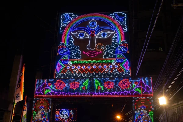 stock image Howrah, West Bengal, India- 3rd October, 2022 : Decorated and illuminated street during Durga puja festival night. Durga puja is biggest festival of Hindusim.