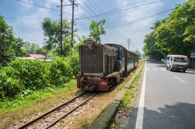 Darjeeling,West Bengal,India - 10th August 2023 : Diesel Toy train, running over narrow gauge railway between New Jalpaiguri and Darjeeling, beside Himalayan roads. Darjeeling Himalayan Railway, clipart