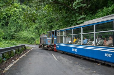 Darjeeling,West Bengal,India - 10th August 2023 : Diesel Toy train, running over narrow gauge railway between New Jalpaiguri and Darjeeling, beside Himalayan roads. Darjeeling Himalayan Railway,
