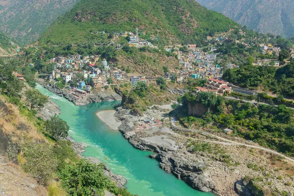 stock image Devprayag, Godly Confluence,Garhwal,Uttarakhand, India. Here Alaknanda meets the Bhagirathi river and both rivers thereafter flow on as the Holy Ganges river or Ganga. Sacred place for Hindu devotees.