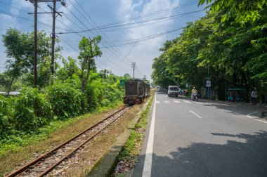 Darjeeling,West Bengal,India - 10th August 2023 : Narrow gauge railway between New Jalpaiguri and Darjeeling.. Diesel Toy train passing through Himalayan roads. Darjeeling Himalayan Railway, clipart