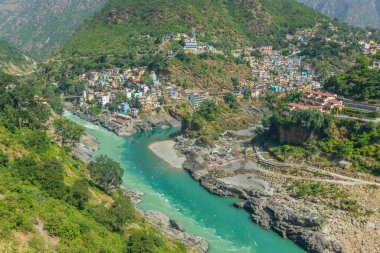 Devprayag, Godly Confluence,Garhwal,Uttarakhand, India. Here Alaknanda meets the Bhagirathi river and both rivers thereafter flow on as the Holy Ganges river or Ganga. Sacred place for Hindu devotees. clipart