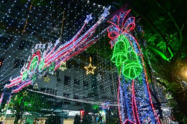 Kolkata, West Bengal, India - 24.12.2023 : Festive Christmas lighting at Park street. Decorated lighting illuminating busy Park street at night. Citizens visit Park street to enjoy festive mood. clipart