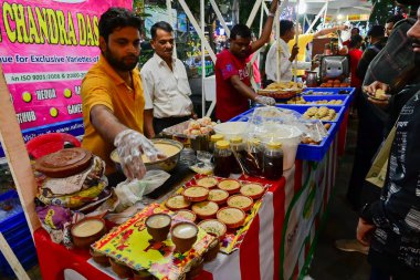 Kolkata, West Bengal, India - 24.12.2023 : Delicious street food and snacks for citizens at food court during Christmas at Park street. People visit Park street to enjoy festive mood during Christmas. clipart