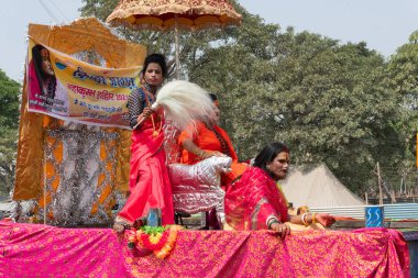 Haridwar, Uttarakhand, India - 16th April 2021 : Maha kumbhmela event. Hindu transgender devotees going for shahi snaan on Kumbhmela, on decorated vehicles and shouting prayers for Lord Shiva. clipart