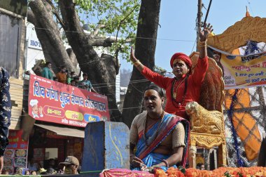 Haridwar, Uttarakhand, India - 15th April 2021 : Maha kumbhmela event. Hindu transgender devotees going for shahi snaan on Kumbhmela, on decorated vehicles and shouting prayers for Lord Shiva. clipart