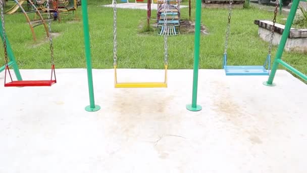 Empty Swing Moving Park Playground Floor Empty Colorful Metal Swings — 비디오