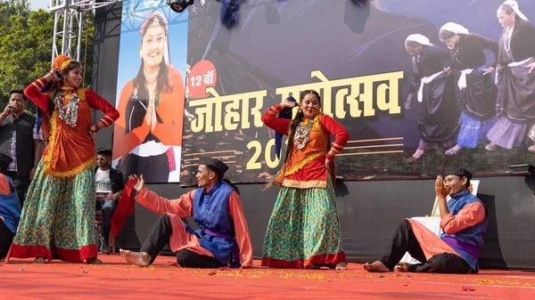 stock image Tribal men and women wearing traditional attire dancing in Haldwani, Uttarakhand India on 17 January 2023