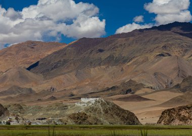 Hanle monastery on top of a hill with mountains and clouds at Ladakh India on 5 august 2023 clipart