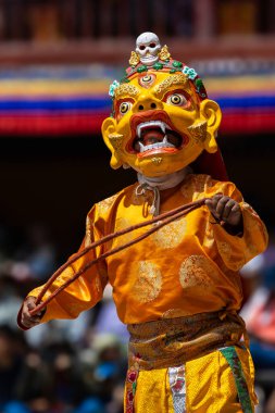 A colorful mask dance being performed at Hemis Monastery at Leh, Ladakh India. clipart