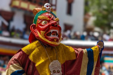 A colorful mask dance being performed at Hemis Monastery at Leh, Ladakh India. clipart