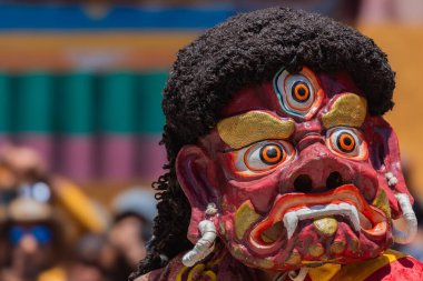 Close up of a colorful mask worn by Buddhist monks during Hemis Monastery festival at Leh, Ladakh India. clipart