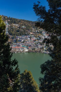 An aerial view of The Naini lake, a famous tourist destination and the construction around it at Nainital on 2 January 2022. clipart