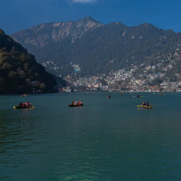 stock image A panoramic view of tourists on paddle boats at Naini lake in Nainital, India, a famous tourist destination. Clicked on 2 Jan 2022. 