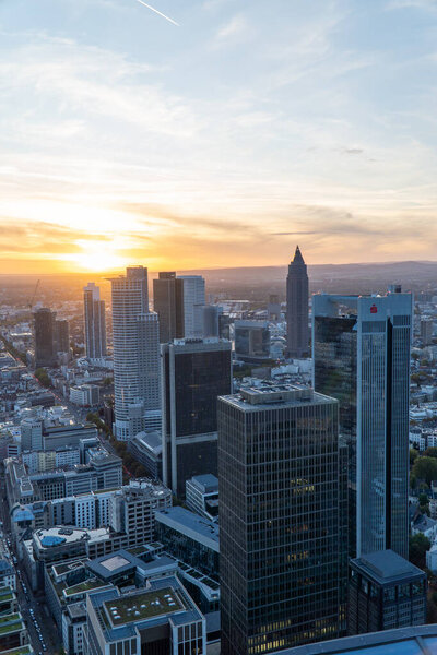 Aerial view of the Frankfurt skyline during sunset. Modern building reflecting the last sunligh of the day.