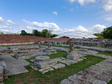 Pliska fortress near Shumen city in Bulgaria. Ancient town with streets and houses. clipart