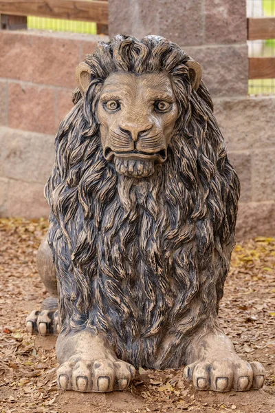 male lion statue close up is looking at the camera