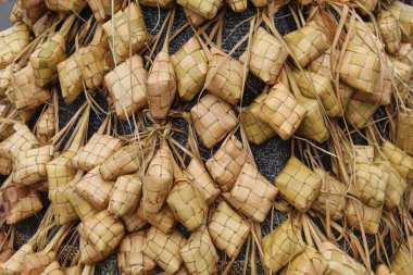 Background of ketupat, rice cake wrapped in a diamond shaped container of woven palm leaf pouch clipart