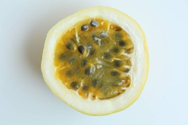 Yellow passion fruit, isolated on white background. Flat lay or top view clipart