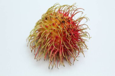 One Rambutan or Nephelium lappaceum fruit or Hairy Lychee, isolated on white background clipart