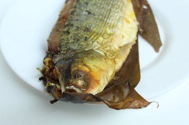 Bandeng Presto is milk fish cooked with high pressure cooker to make fish bone become softer. Signature dish from Juwana and Semarang, Indonesia. isolated on white background clipart