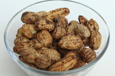 Boiled peanuts or steamed peanut, on a transparent bowl, isolated on white background clipart