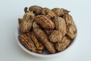 Boiled peanuts or steamed peanut, on a transparent bowl, isolated on white background clipart