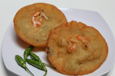 Pia pia udang, is a flour dough fried with shrimp. Isolated on white background clipart