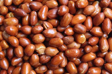 Kızarmış yerfıstığı, yer fıstığı, maymun fındığı ya da Arachis hipogaea 'nın arka plan dokusu. Düz ya da üst görünüm