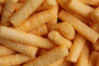 Stik Balado 'nun arka plan dokusu, turuncu renkli tuzlu toz kaplı krakerler