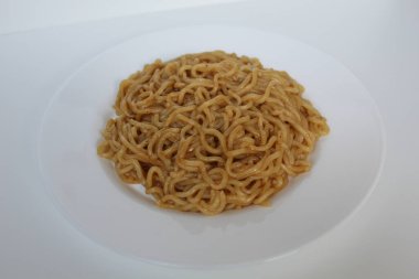 A serving of fried instant noodles, on white plate, isolated on white background clipart