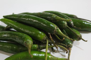 Big green chili peppers, isolated on white background clipart