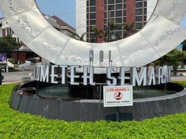 Semarang, Indonesia - December 24th 2023: Kilometer Zero Monument of Semarang City, marked by an iconic round water fountain clipart