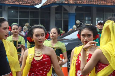 Traditional make up and attire of javanese women for traditional dancing performance. Wearing kemben, konde and scarf. Jepara, Indonesia, April 29th 2023 clipart