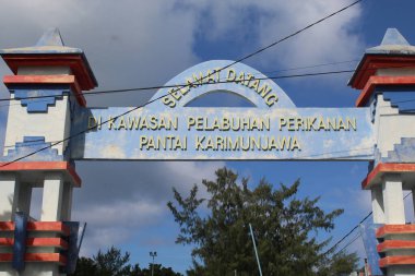 Welcoming sign gate of fishery harbor in Karimun Jawa. Jepara, Indonesia, April 29th 2023 clipart