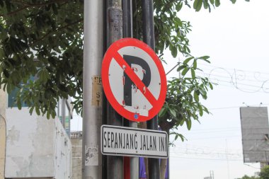 Stop sign on the street. Semarang, Indonesia, December 25th 2022 clipart