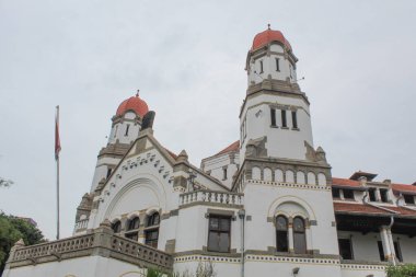 Lawang Sewu, iconic ancient building and tourist attraction at Semarang City. Cloudy sky background. Semarang, Indonesia, December 25th 2022 clipart