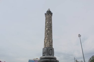 Tugu Muda, landmark and icon of Semarang City. Cloudy sky background. Semarang, Indonesia, December 25th 2022 clipart