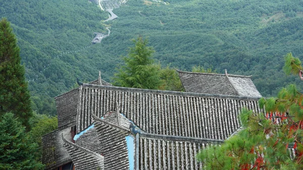 The old temple view with the ancient Chinese buildings located on the top of the mountains