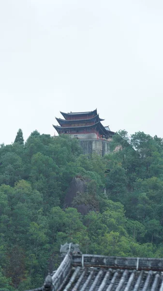 The old temple view with the ancient Chinese buildings located on the top of the mountains