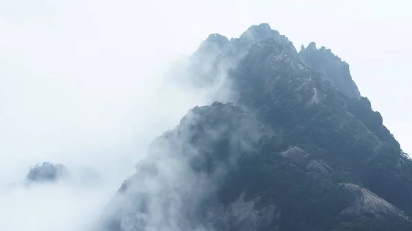 stock image The beautiful mountains landscapes with the green forest and the erupted rock cliff as background in the countryside of the China